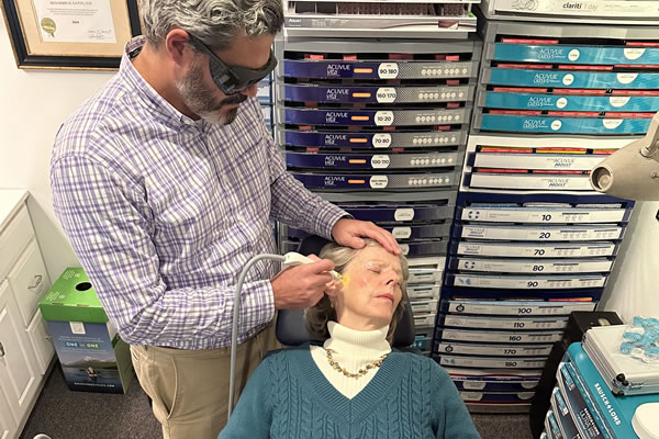 Dr. Gates treating one of his patients for dry eyes with OptiLight IPL technology.
